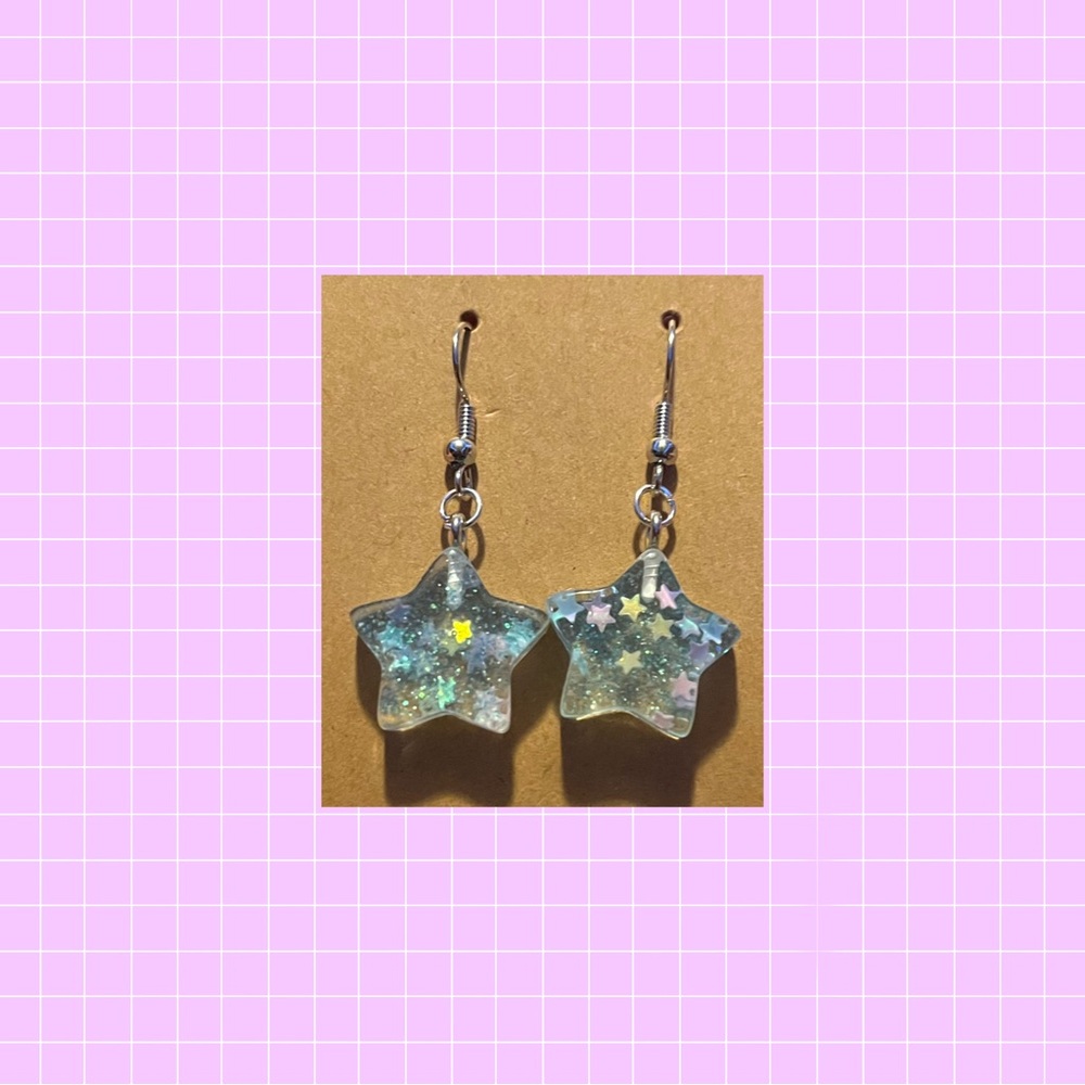 Blue sparkly star earrings